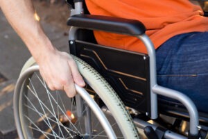 Man in a wheelchair after an accident. Discover how a personal injury attorney serving Valley Grande can help you recover damages.