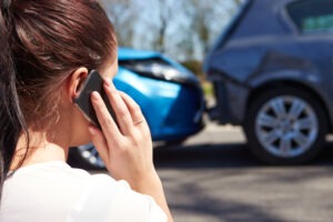 A woman after a car accident. Discuss your legal options after a collision with an Atlanta car accident lawyer.