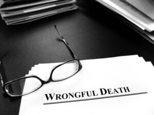 A stack of wrongful death paperwork. You can contact a lawyer for information about the elements of wrongful death.