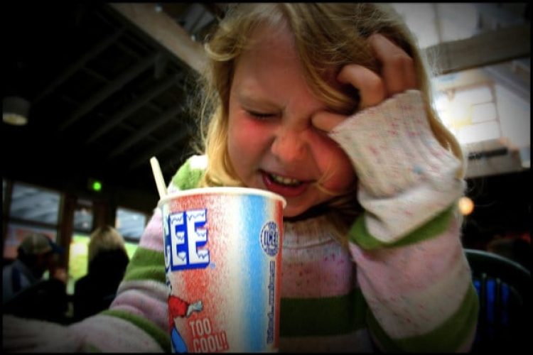 photo of girl and icee drink with brain freeze